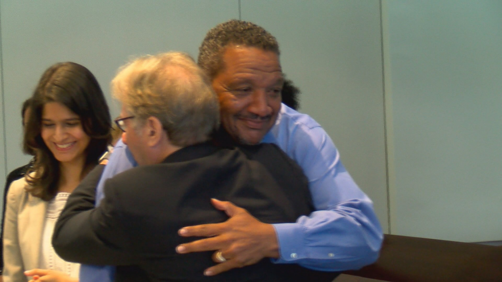 Darryl Howard hugs his attorney after judge announces his release