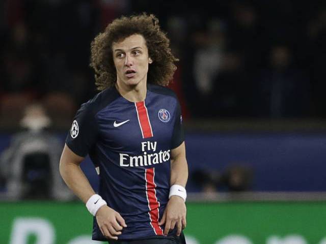 David Luiz running with the ball during a Champions League match