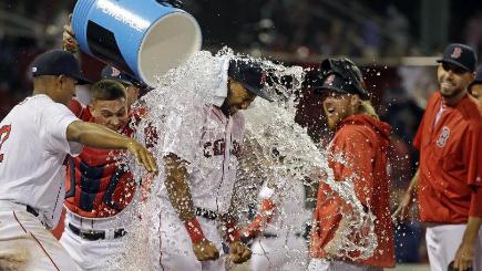 Boston's Chris Young gets dunked after the Red Sox's dominant performance