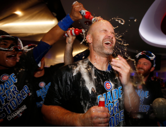 David Ross celebrates big with teammates in the clubhouse Friday the day after his own celebration