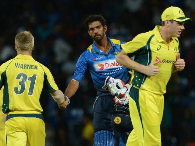 David Warner is congratulated by Sachithra Senanayake in Pallekele