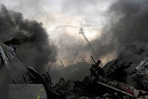 TOPSHOT- Bangladeshi firefighters work to put out a fire at the site of an explosion in a factory in the key Bangladeshi garment manufacturing town of Tongi just north of the capital Dhaka