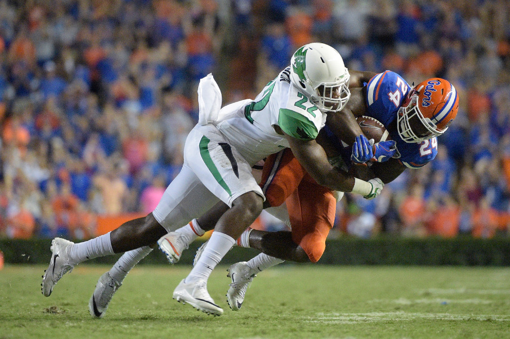 North Texas linebacker E.J. Ejiya tackles Florida running back Mark Thompson during the Gators 32-0 win over the Mean Green on Saturday