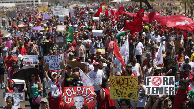 Demonstrators protest against Michel Temer after an Independence Day military parade in Brasilia