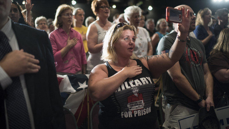 Brandie Seagrove of Harrisburg Pa. recites the Pledge of Allegiance before Republican vice presidential nominee Mike Pence spoke during a campaign rally in Lancaster Pa