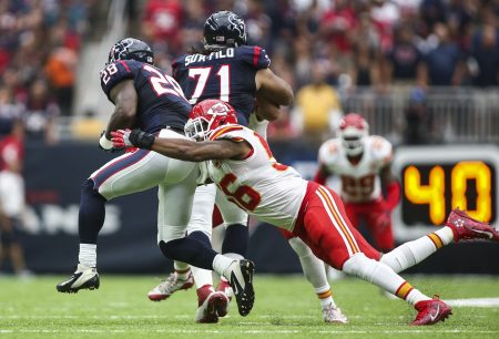 Derrick Johnson dives to tackle Houston Texans running back Alfred Blue during the second quarter