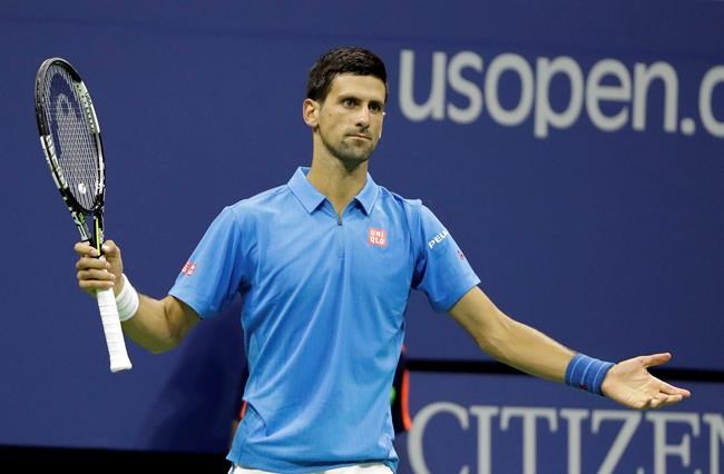 Novak Djokovic of Serbia reacts after missing a shot against Kyle Edmund of Britain during the fourth round of the U.S. Open tennis tournament Sunday Sept. 4 2016 in New York