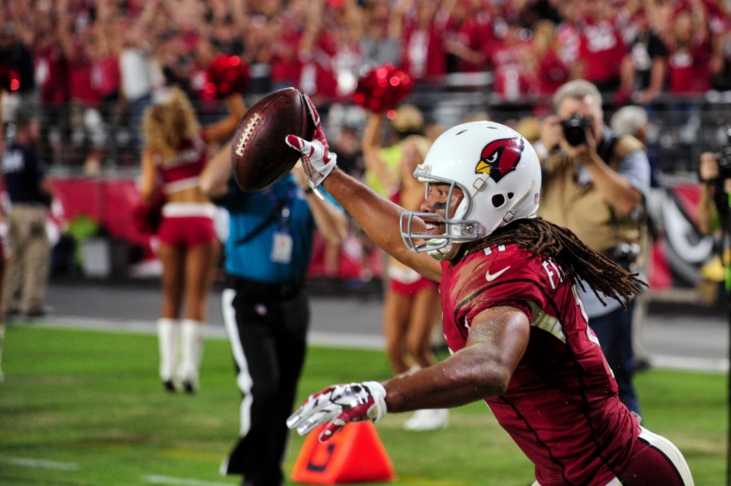 Sep 11 2016 Glendale AZ USA Arizona Cardinals wide receiver Larry Fitzgerald celebrates after scoring his 100th NFL touchdown during the second half against the New England Patriots at University of Phoenix Stadium. Mandatory Credit Matt Karto