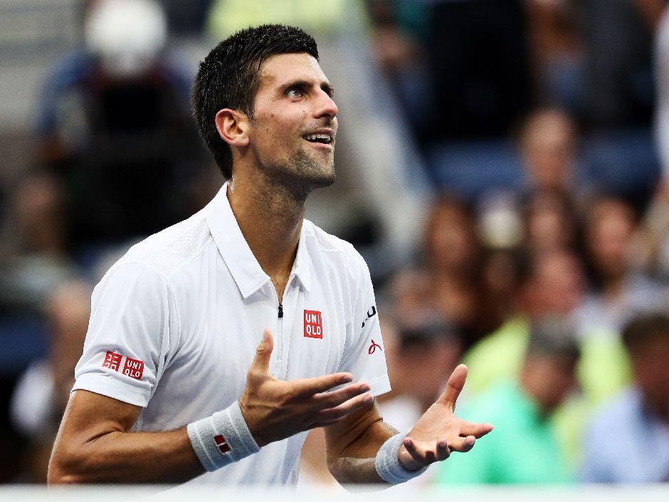 Novak Djokovic sends his heart to the crowd after defeating Gael Monfils 6-3 6-2 3-6 6-2 in their men's semifinal on Friday Sept. 9 2016