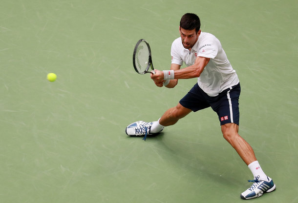 Djokovic slides into a backhand