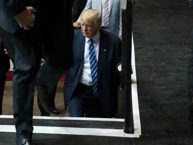 Republican Presidential candidate Donald Trump takes the stage at a campaign rally at the Canton Memorial Civic Center