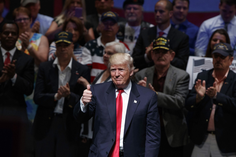 Republican presidential candidate Donald Trump gives a thumbs up after a town hall in Virginia Beach Va