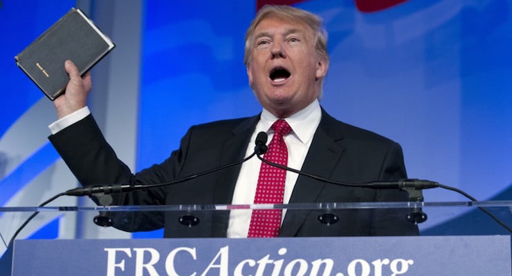 Donald Trump holds up his Bible as he speaks during the Values Voter Summit Sept. 25 in Washington