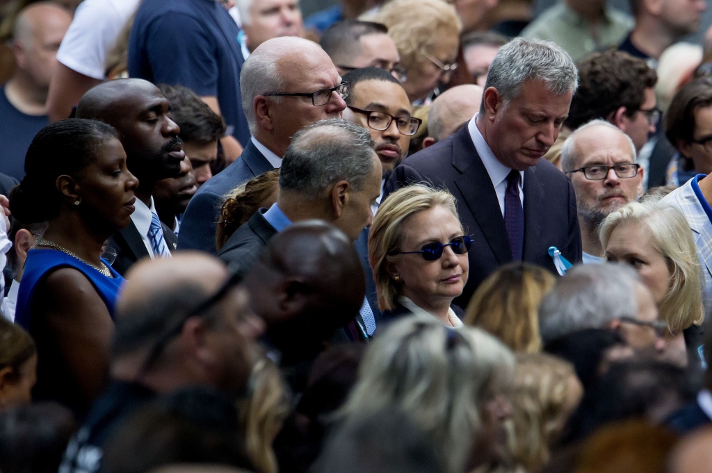 SEPT11 ANNIVERSARY 1-85 Hillary Clinton is flanked by Sen. Chuck Schumer D-N.Y. left and New York City Mayor Bill de Blasio during a ceremony to mark the 15th anniversary of the 9/11 attacks in lower Manhattan on Sunday