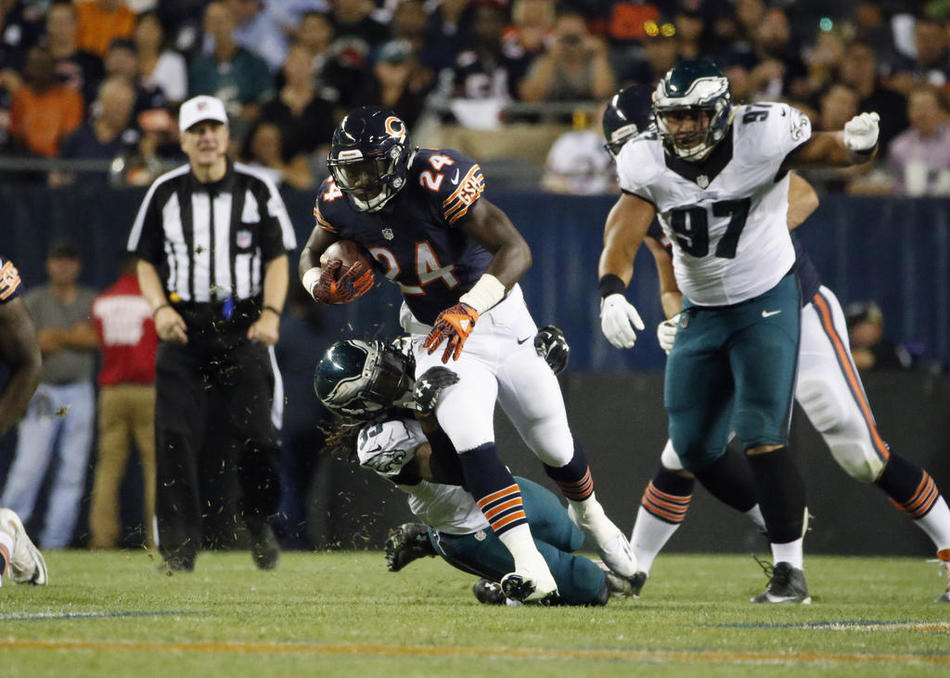 Chicago Bears running back Jordan Howard tries to break away from Philadelphia Eagles defensive back Ron Brooks during the second half of an NFL football game Monday Sept. 19 2016 in Chicago