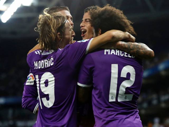 Real Madrid's James Rodriguez celebrates with teammates after scoring against RCD Espanyol in Cornella de Llobregat