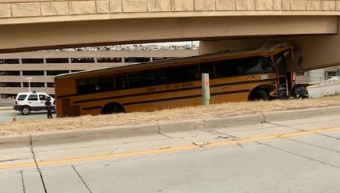 Driver killed, 18 hurt in Denver airport school bus crash