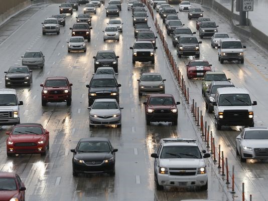 Drivers make their way in the rain along Interstate 95 on Aug. 30 2016 in Miami