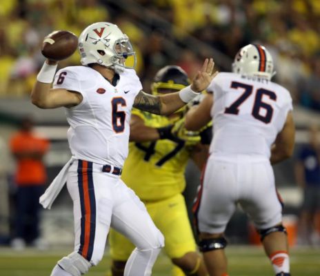 Virginia quarterback Kurt Benkert left drops back