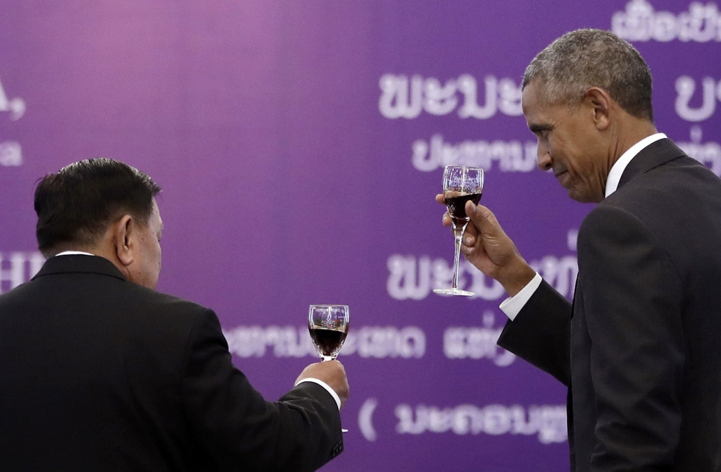 Laotian President Bounnhang Vorachit left and U.S. President Barack Obama toast during an official state luncheon at the Presidential Palace in Vientiane Laos Tuesday Sept. 6 2016