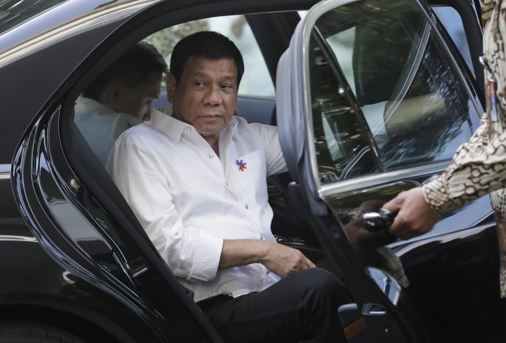 Philippine President Rodrigo Duterte steps out of his limousine upon arrival at Merdeka Palace to meet Indonesian counterpart Joko Widodo in Jakarta Indonesia Friday Sept. 9 2016