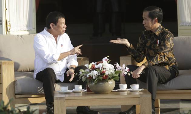 Philippine President Rodrigo Duterte left talks with his Indonesian counterpart Joko Widodo during their meeting at Merdeka Palace in Jakarta Indonesia Friday Sept. 9 2016. Duterte is currently on a two-day visit to the country. (AP