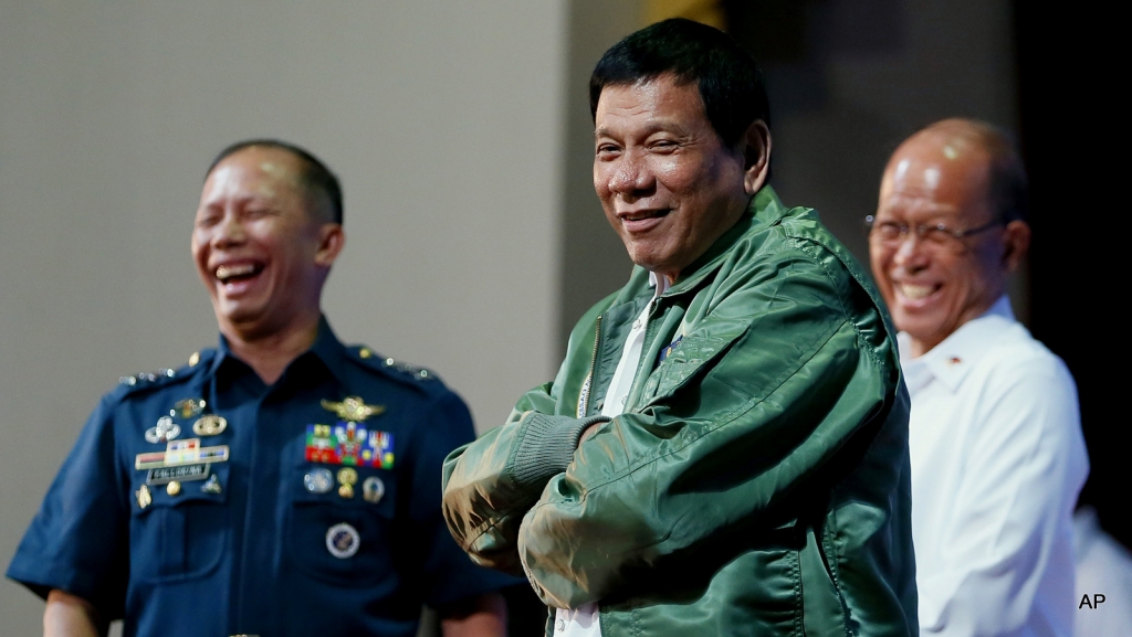 Philippine President Rodrigo Duterte wears a pilot's jacket which was presented to him during his'Talk with the Airmen on the anniversary of the 250th Presidential Airlift Wing Tuesday Sept. 13 2016 at the Philippine Air Force headquarters in suburban