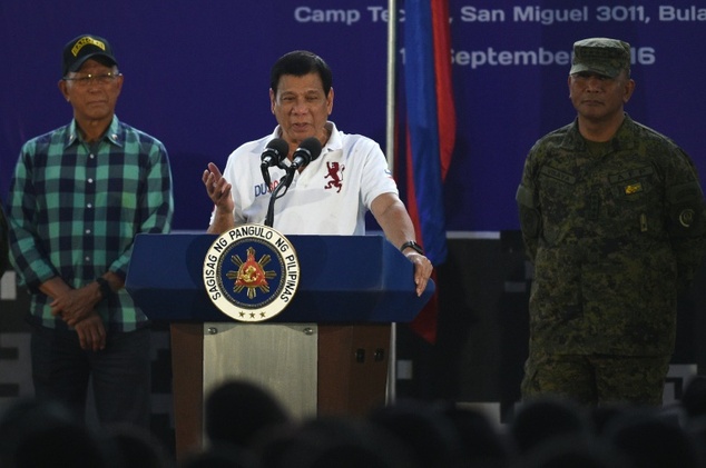 Philippine President Rodrigo Duterte delivers a speech before members of the Scout Rangers regiment at a military training camp in San Miguel town Bulac