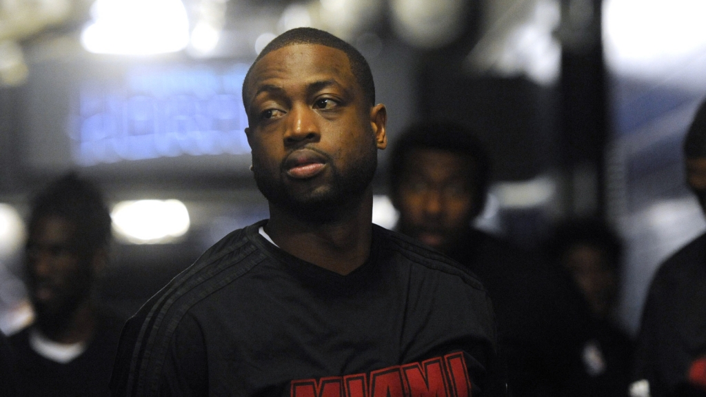 Miami Heat guard Dwyane Wade walks to the court