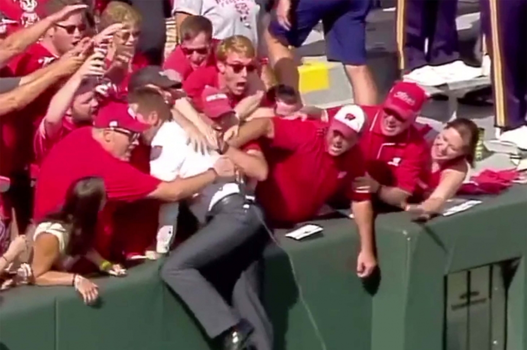 ESPN's Todd Mc Shay does Lambeau Leap into Wisconsin fans