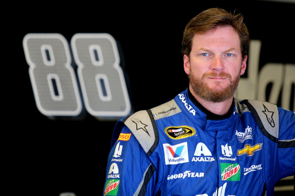 DAYTONA BEACH FL- JUNE 30 Dale Earnhardt Jr. driver of the #88 Nationwide Chevrolet stands in the garage area during practice for the NASCAR Sprint Cup Series Coke Zero 400 at Daytona International Speedway