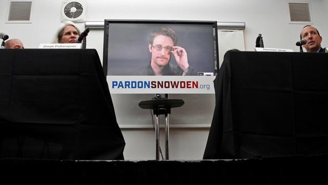 Edward Snowden speaks via video link during a news conference in New York City