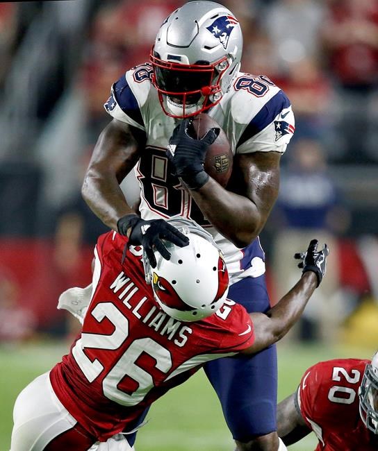 New England Patriots tight end Martellus Bennett hits Arizona Cardinals cornerback Brandon Williams during the second half of an NFL football game Sunday Sept. 11 2016 in Glendale Ariz