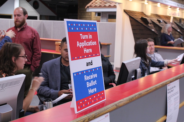 Elections staff at the South Early Vote Center prepared for the opening of no-excuses absentee voting on Sept. 23