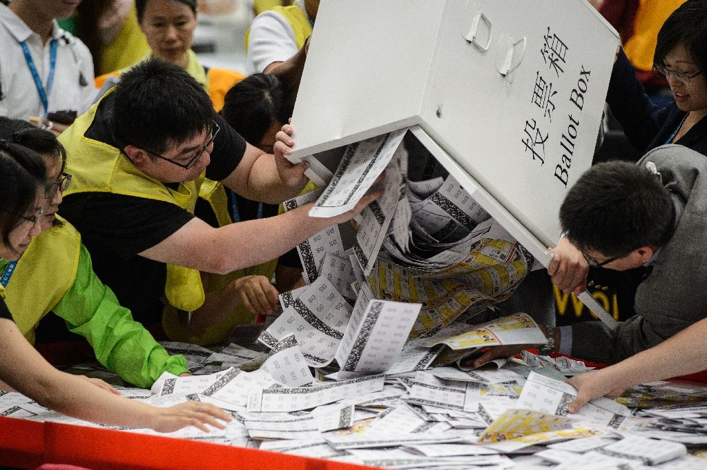 Electoral officials empty a ballot box for counting in Hong Kong early on Sept 5 2016. AFP