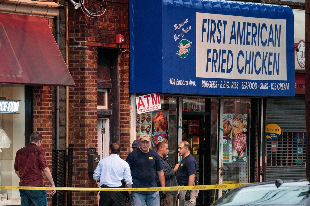 Members of the Federal Bureau of Investigation and other law enforcement officials investigate a residence in connection to Saturday's bombings in Seaside Park adnd Manhattan