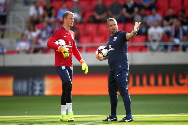 England goalkeeper Joe Hart with goalkeeper coach Martyn Margetson in Slovakia