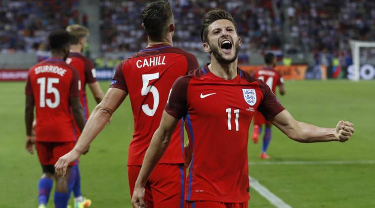 England's Adam Lallana celebrates scoring their first goal with team mates