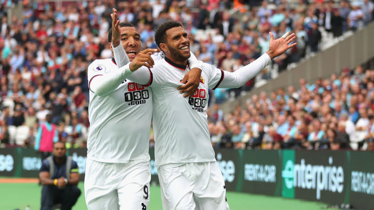 Etienne Capoue celebrates Watford's third goal with Troy Deeney as the visitors come from 2-0 down to win 4-2