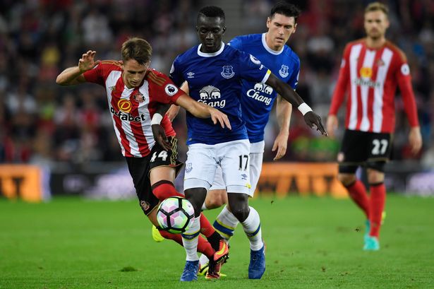 Everton's Idrissa Gueye challenges Adnan Januzaj of Sunderland during the Premier League match at the Stadium of Light