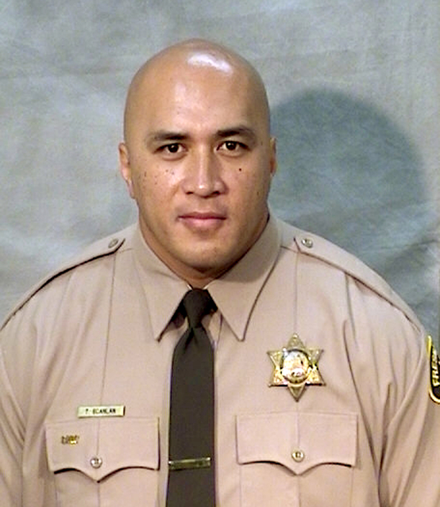 Fresno County Sheriff's Office shows corrections officer Toamalama Scanlan. He was one of two unarmed officers critically