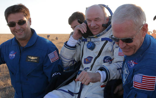 U.S. ground personnel carry U.S. NASA astronaut Jeff Williams after landing in a remote area near the town of Zhezkazgan Kazakhstan Wednesday Sept. 7 2016. The record-setting American and two Russians landed safely back on Earth Wednesday after a six