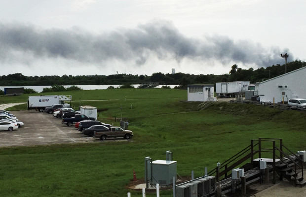 Smoke rises from a SpaceX launch site at Cape Canaveral Fla. on Thursday. NASA said SpaceX was conducting a test firing of its unmanned rocket when a blast occurred