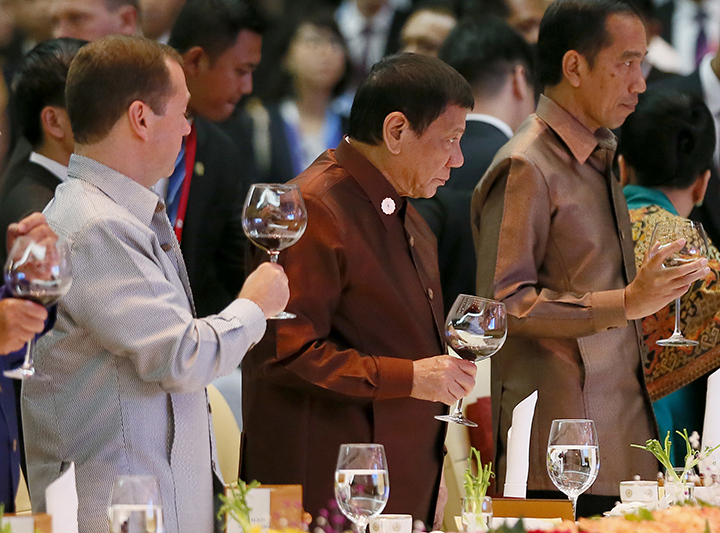 From left Russian Prime Minister Dimitry Medvedev Philippine President Rodrigo Duterte and Indonesian President Joko Widodo make a toast during the gala dinner of ASEAN leaders and its Dialogue Partners in the ongoing 28th and 29th ASEAN Summits and oth