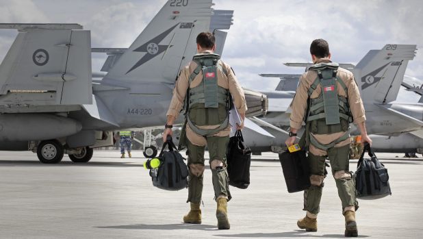 F  A-18F Super Hornet aircrew head to their aircraft