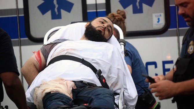 Ahmad Rahami is taken into custody after a shootout with police. Boston Herald  Nicolaus Czarnecki