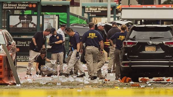 FBI staff examine the scene of Saturday's explosion in Manhattan's Chelsea neighbourhood