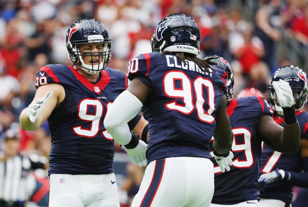 HOUSTON TX- SEPTEMBER 18 J.J. Watt #99 and Jadeveon Clowney #90 of the Houston Texans celebrate a play in the first quarter of their game against the Kansas City Chiefs at NRG Stadium