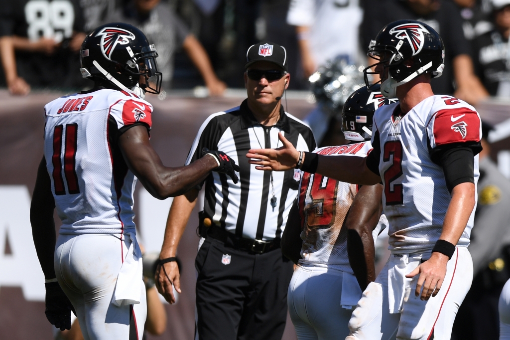 Falcons wide receiver Julio Jones celebrates with quarterback Matt Ryan after the two hooked up for a 21-yard touchdown pass in the second quarter that gave the Falcons a 10-7 lead