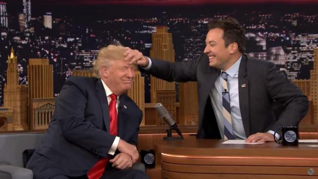 Fallon musses Trump's hair on Tonight Show